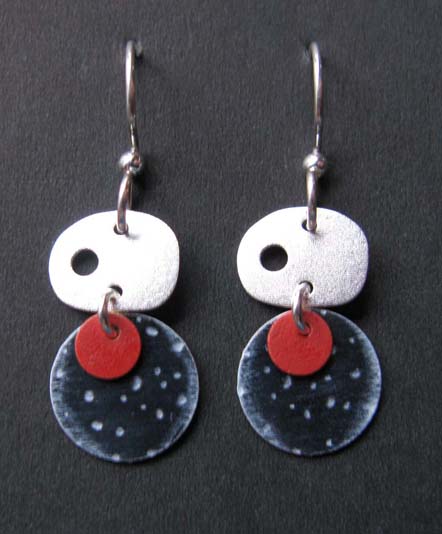 Oval silver with black and red circle earrings
